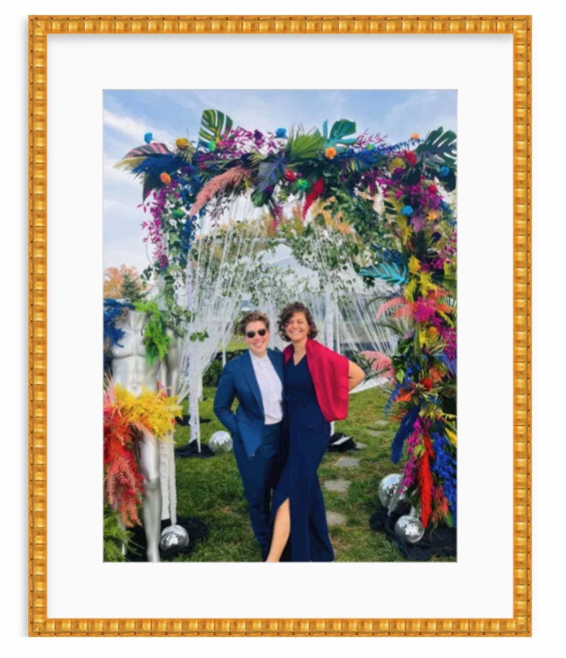 Couple in front of colorful florals