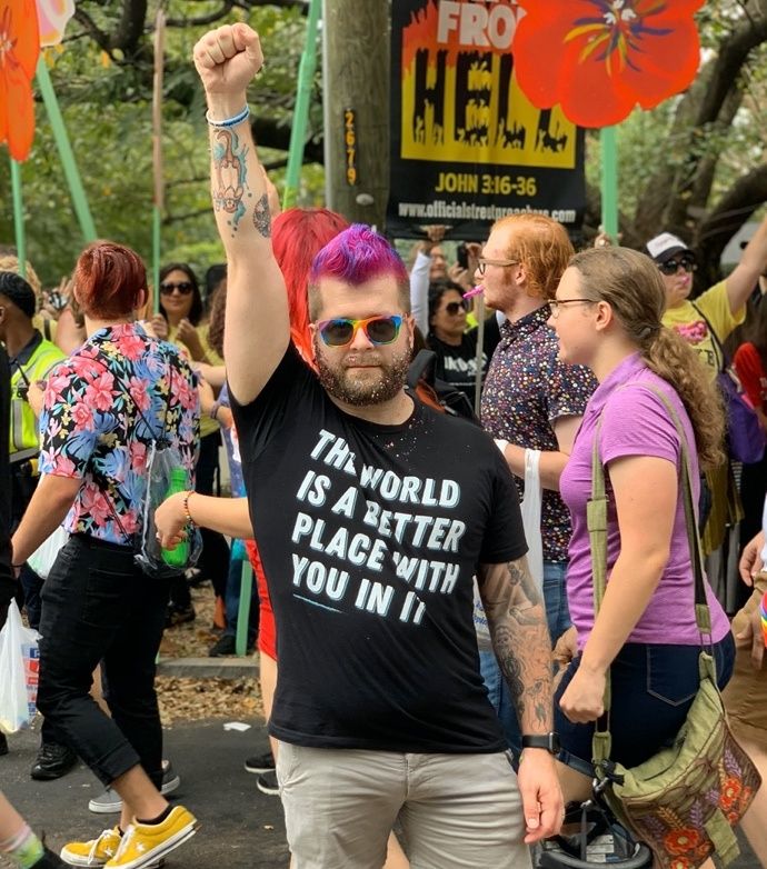 Man raising fist at Pride parade