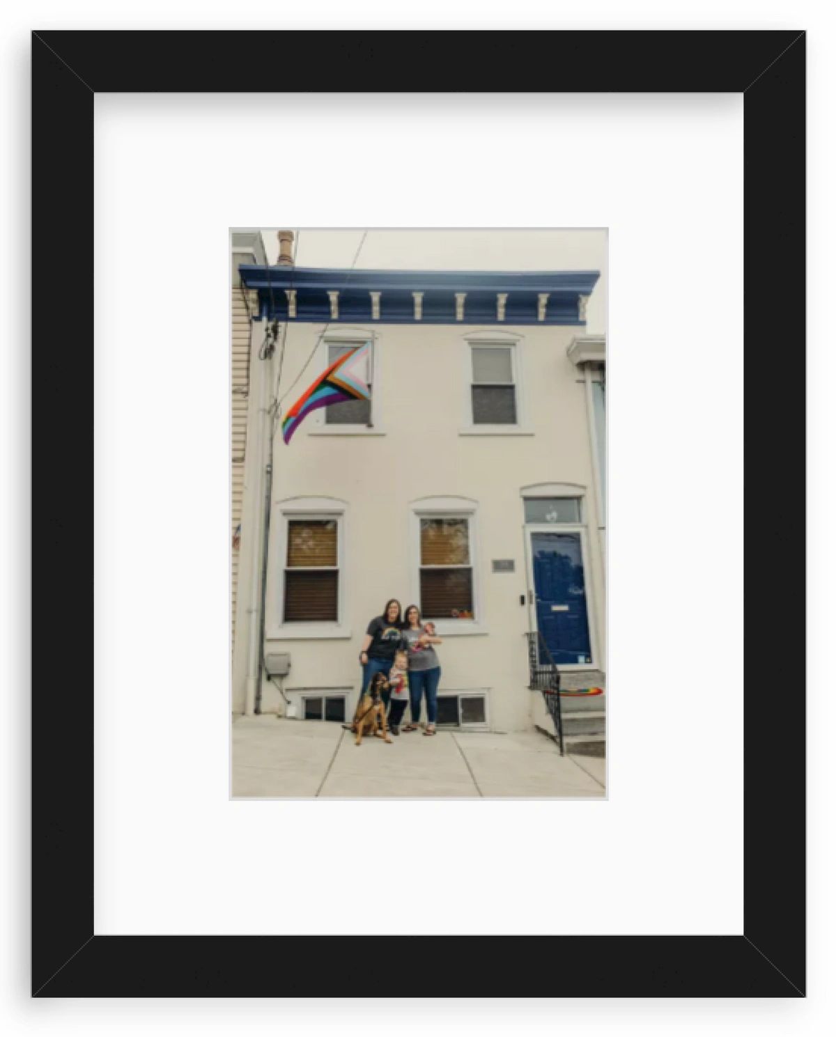 Couple in front of a row house